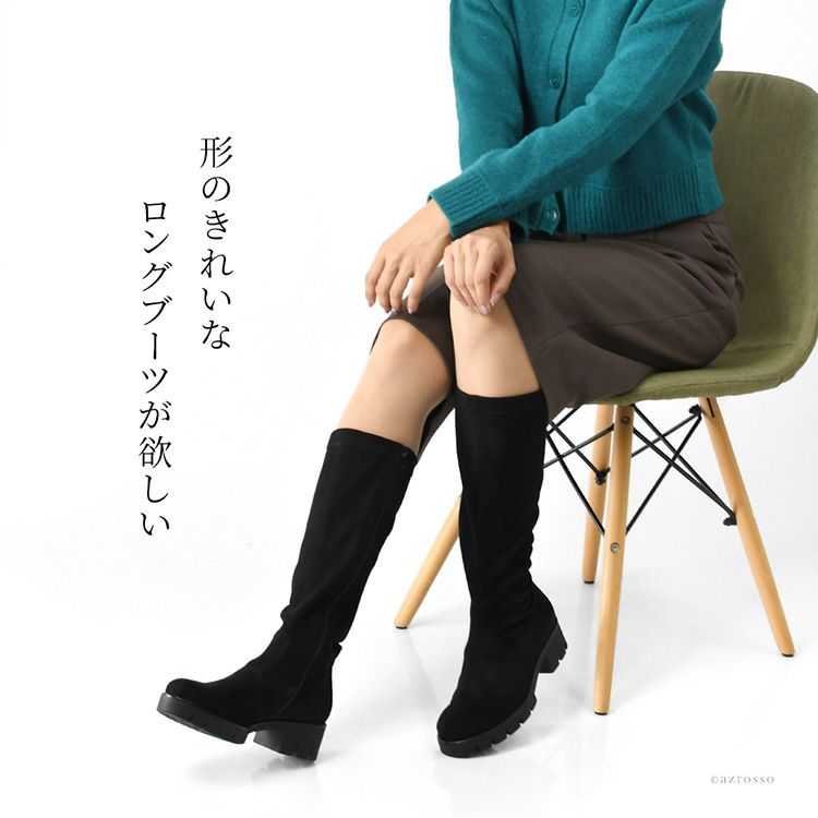 ガボール Gabor の本革ロングストレッチブーツを着用した女性。黒のきれいめなレディースブーツがふくらはぎにぴったり沿い、軽く柔らかいレザーと約5cmのローヒールで歩きやすい。滑りにくいソール仕様の上品な着用イメージ。